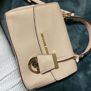 mini pink michael khors purse with gold accents